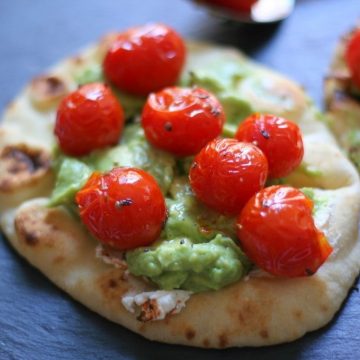 tomatoes and avocado on naan