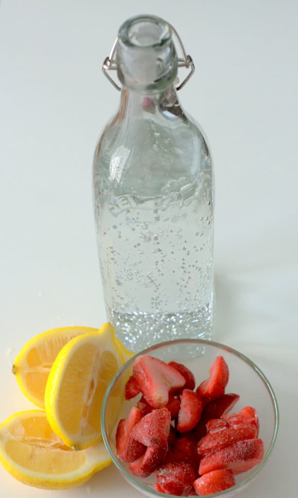 Strawberries, lemons and carbonated water