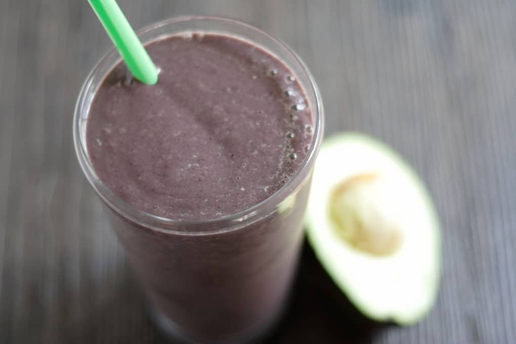 Purple Avocado Smoothie combines oranges, banana, blueberries, spinach and avocado for satisfying meal replacement.