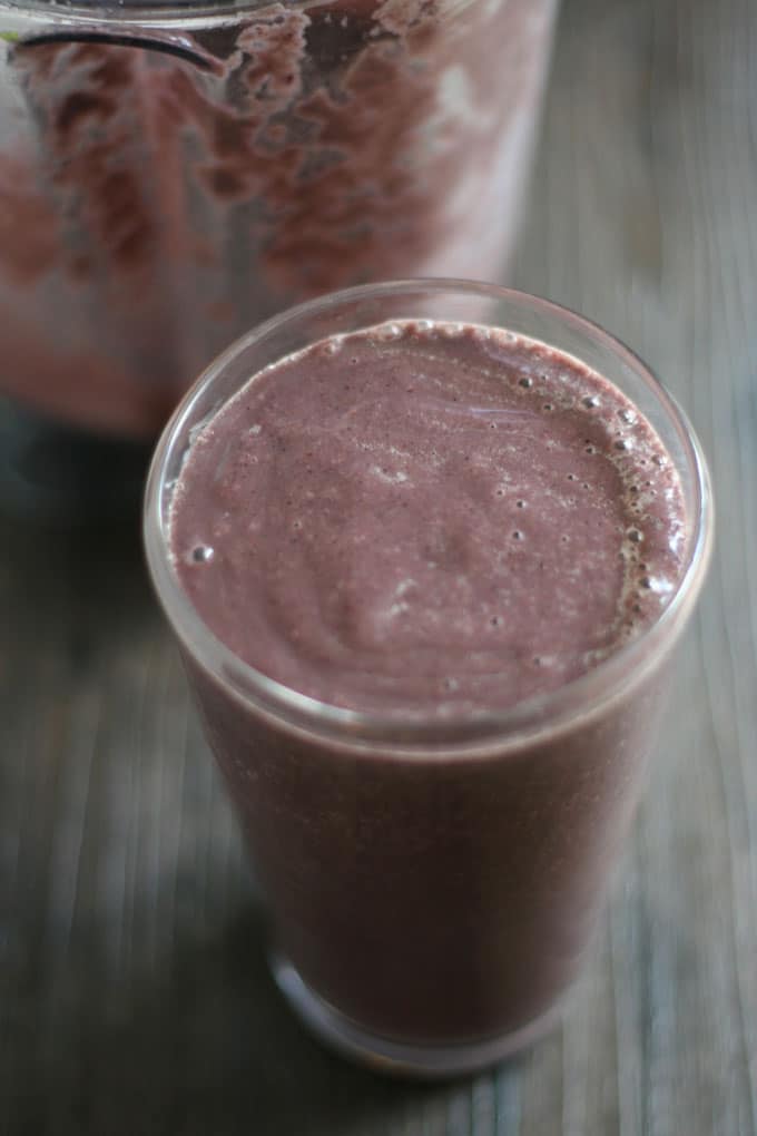 Purple Avocado Smoothie combines oranges, banana, blueberries, spinach and avocado for satisfying meal replacement.