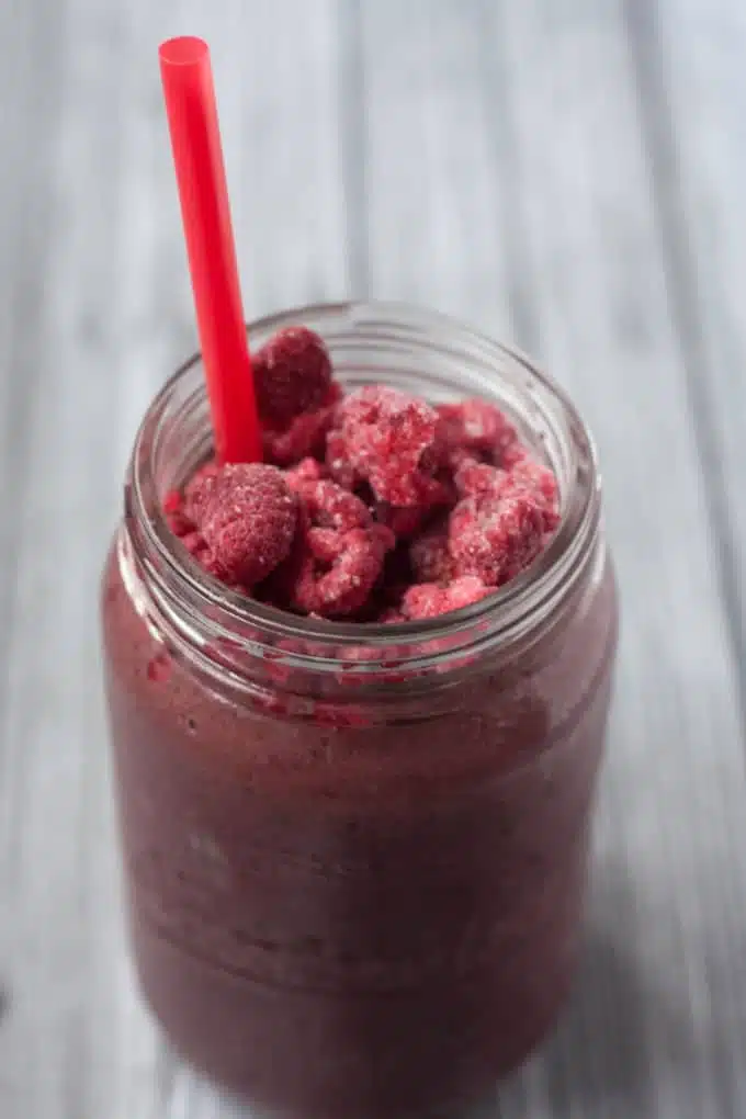 Berry Pineapple Peach Green Protein Smoothie - a great way to start your day off right. This recipe calls for plant protein powder so this is vegan/vegetarian friendly.