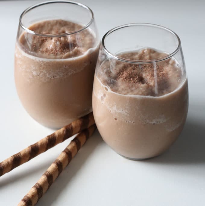 Two glasses of chocolate smoothie
