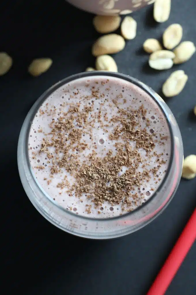 Strawberries, peanuts, oats and coconut/almond milk come together as a light, refreshing strawberry nut smoothie that is surprisingly filling. 