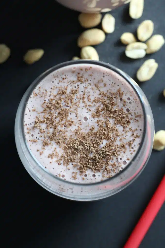 Strawberries, peanuts, oats and coconut/almond milk come together as a light, refreshing strawberry nut smoothie that is surprisingly filling.