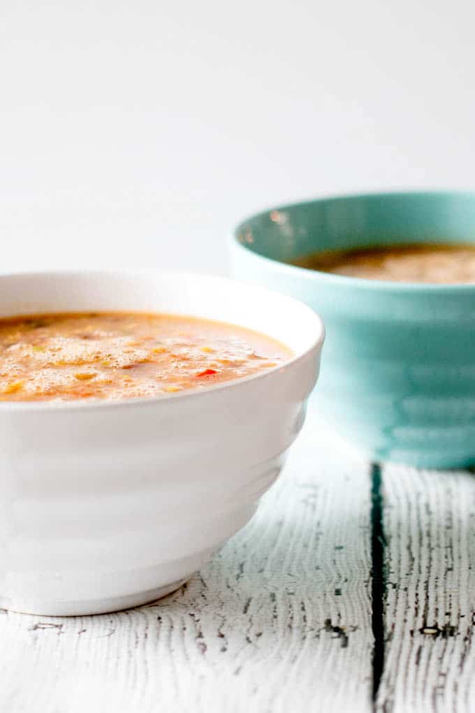 Two bowls of steaming soup