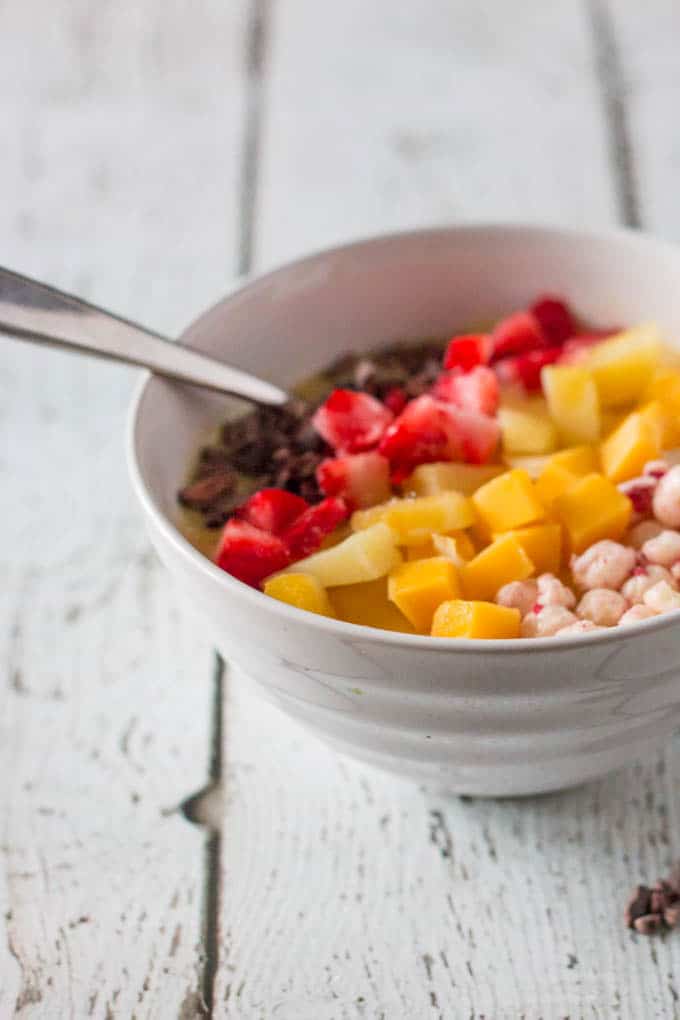 Quick and easy pineapple mango smoothie bowl that you can top with all your favourite treats. 
