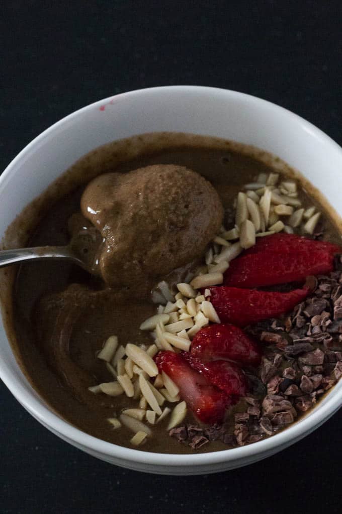 Enjoy a delicious chocolate strawberry smoothie bowl that satisfies your sweet tooth without any guilt. You’d never guess that this smoothie bowl includes a serving of greens.