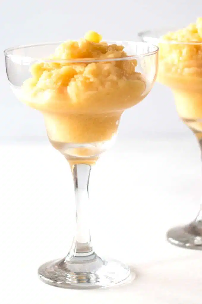 Pineapple Mango Spiced Rum Dessert Cocktail is the perfect summer time drink (or dessert). Can be enjoyed with a spoon or a straw - there are no rules.