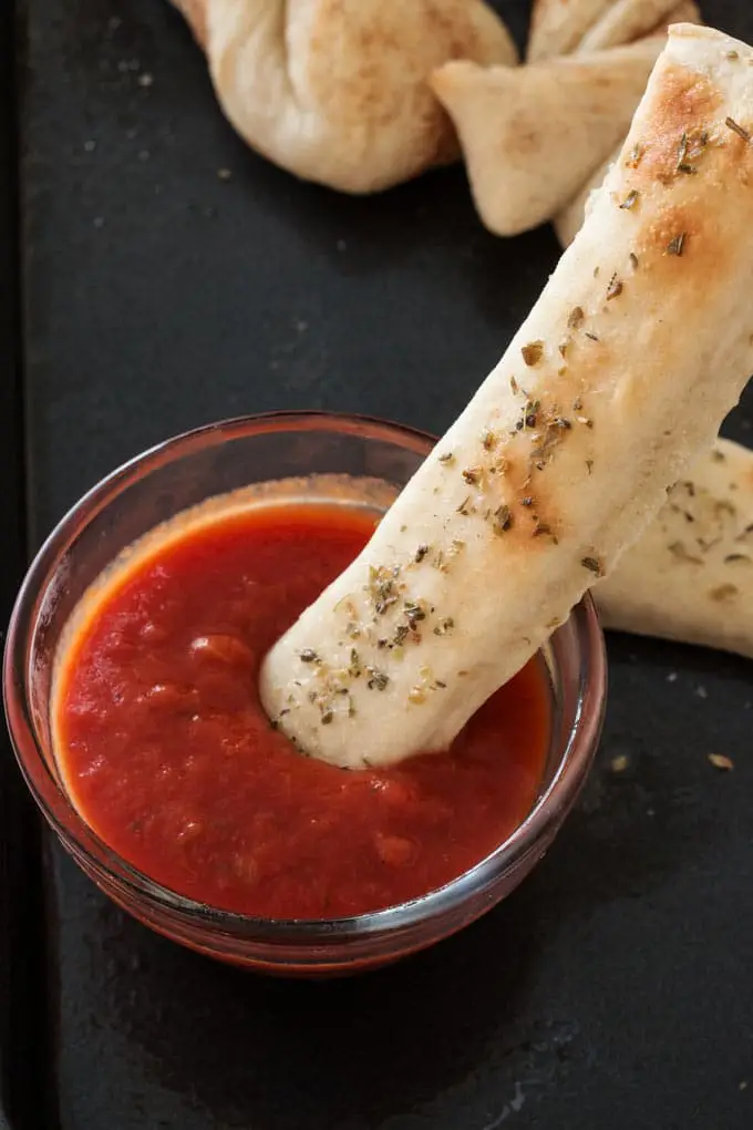 Easy homemade breadsticks made with this simple pizza dough.