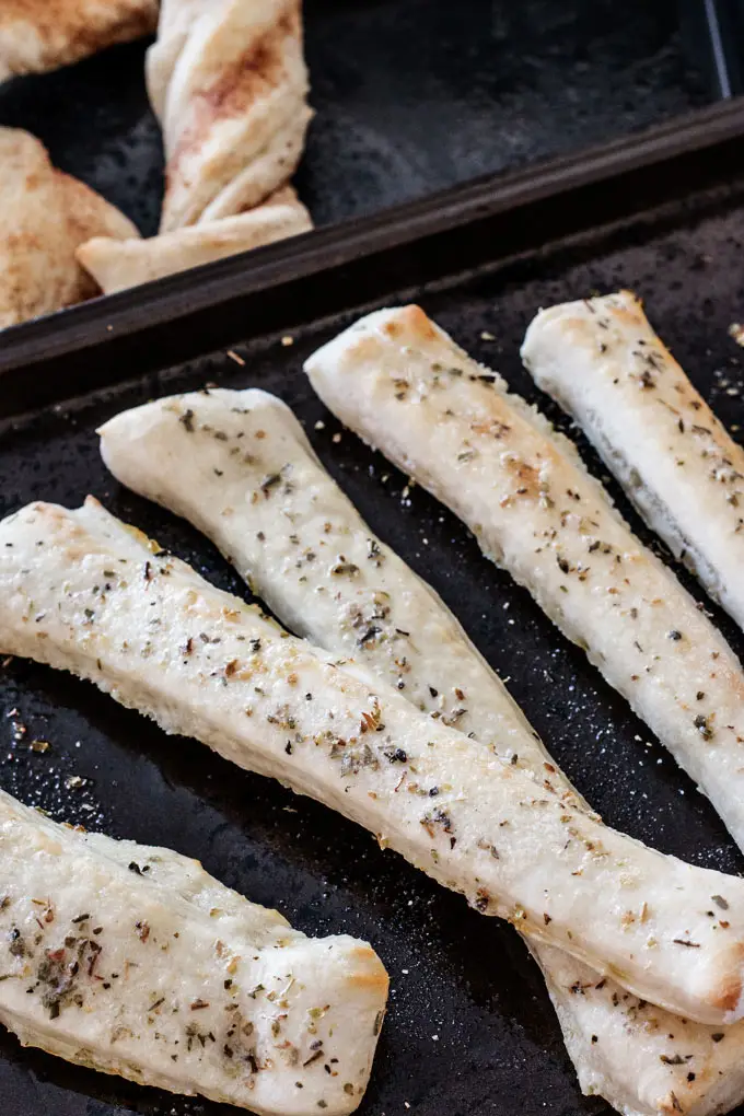 Easy homemade breadsticks made with this simple pizza dough.