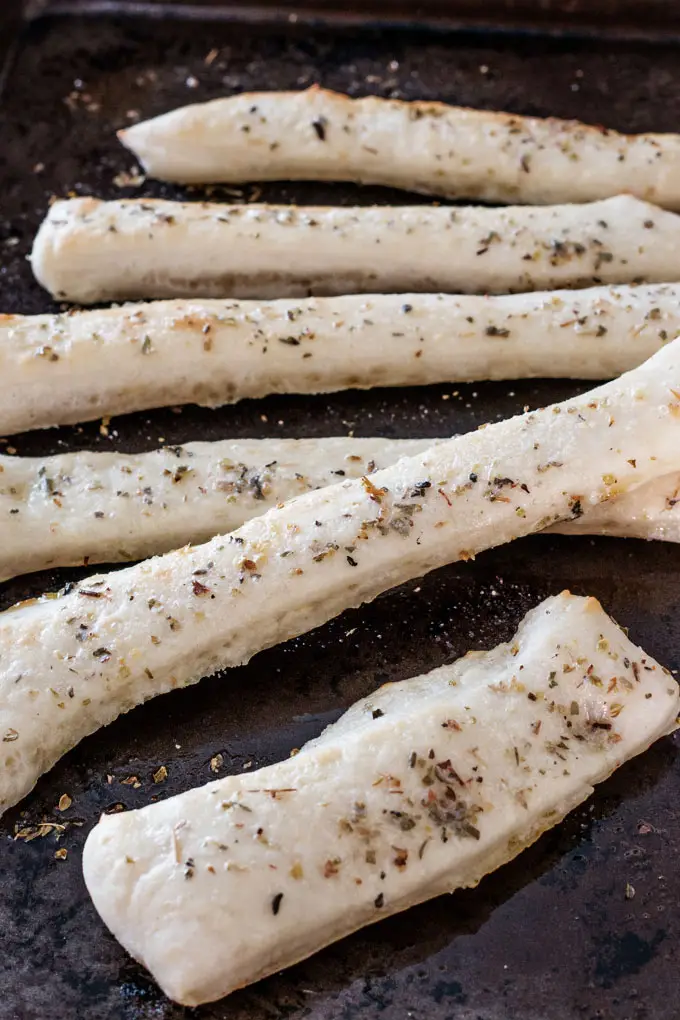 Easy homemade breadsticks made with this simple pizza dough.