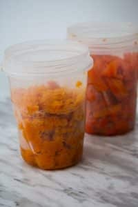 containers of cooked carrots and squash