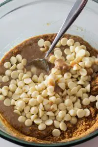 White chocolate chips in bowl of ingredients