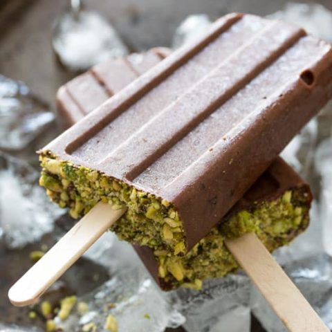 Chocolate popsicles on tray of ice