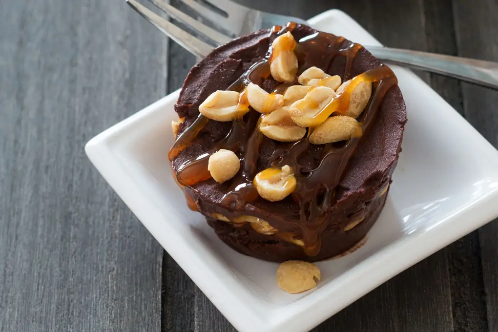 Chocolate Peanut Butter Caramel Ice Cream Cups starts with delicious, creamy 4-ingredient nice cream and ends topped with caramel sauce and peanuts.