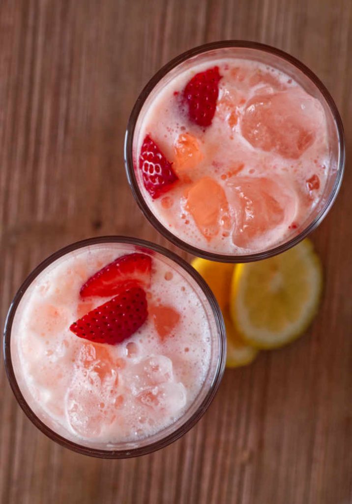 Strawberry lemonade served in two glasses with ice