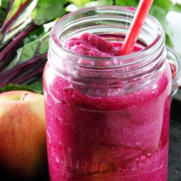 Smoothie in glass with straw
