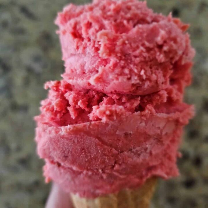 strawberry ice cream on a waffle cone