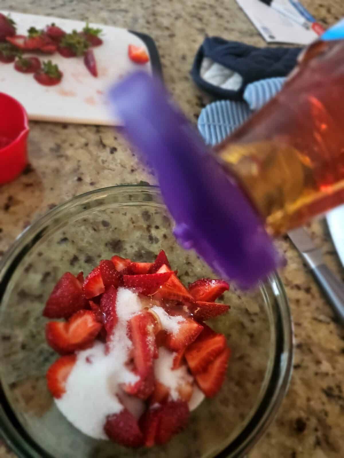 strawberries in bowl with sugar and agave